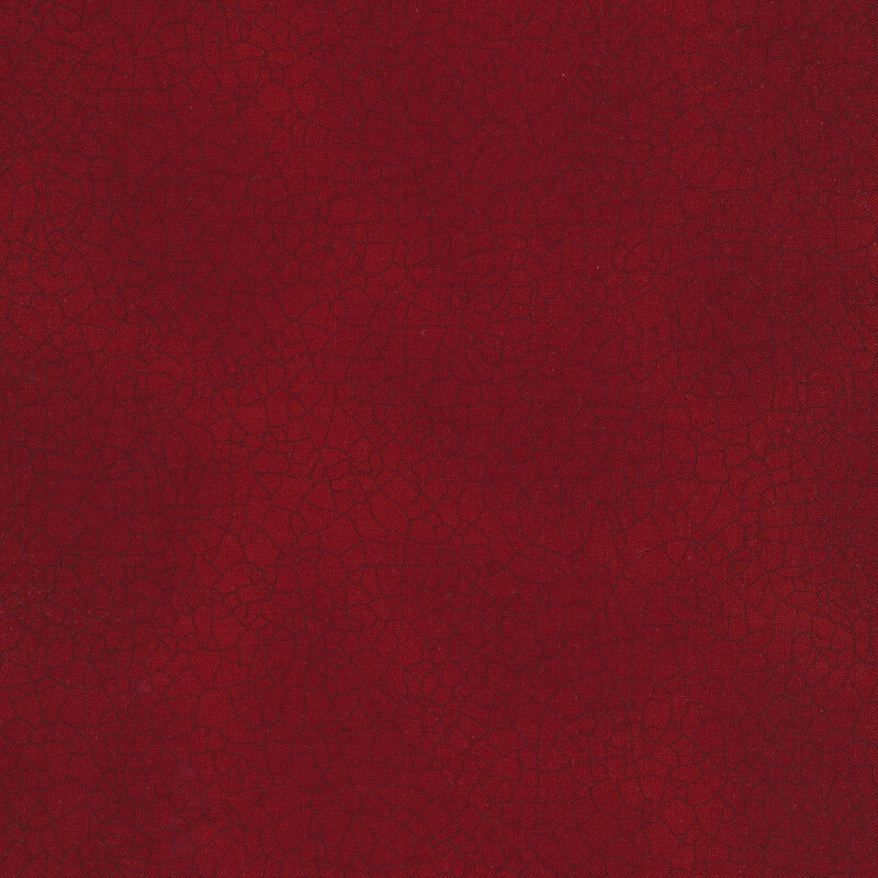 Tonal red mottled fabric with dark red cracks all over