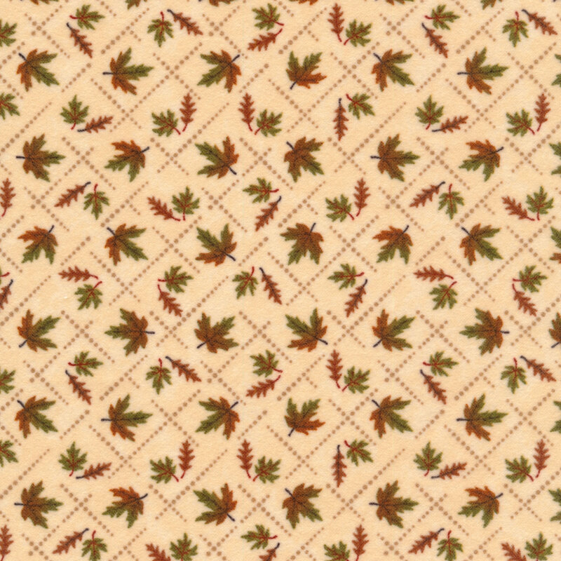 Flannel fabric of small maple leaves inside a lattice print on a cream background.