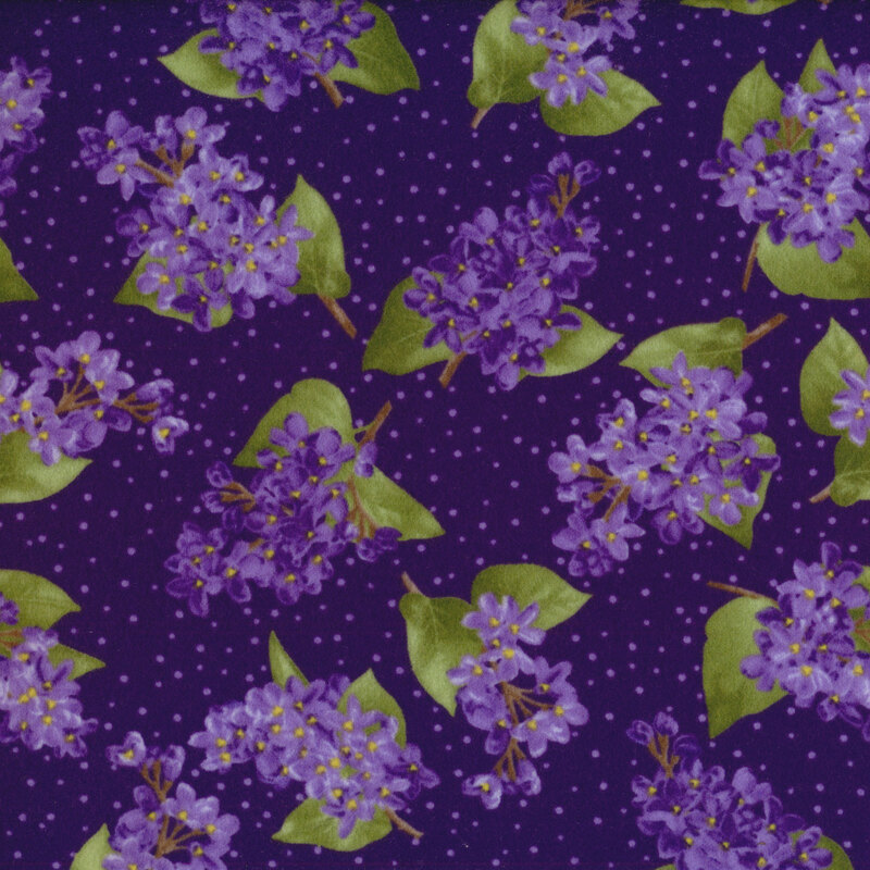 Fabric with small clusters of lilacs and polka dots on a dark purple background.