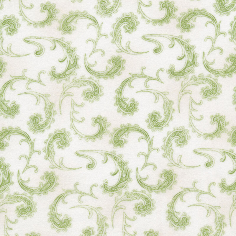Fabric with green swirling paisley on a white background.