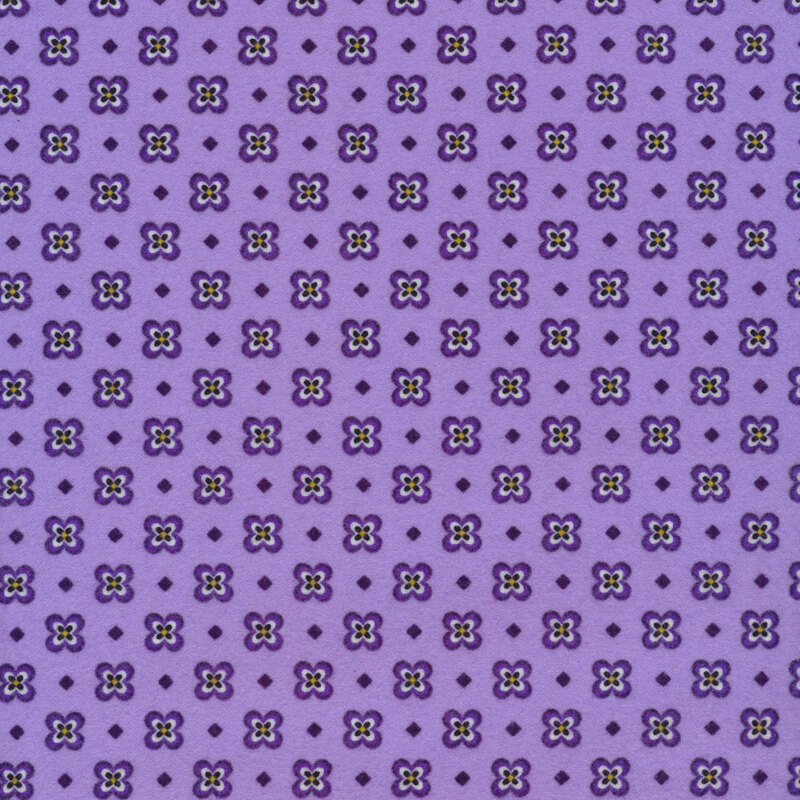 Fabric of a pansy and small diamond print and on a purple background.
