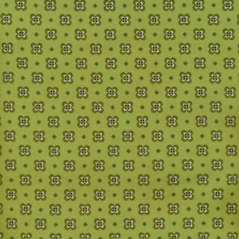 Fabric of a pansy and small diamond print and on a green background.