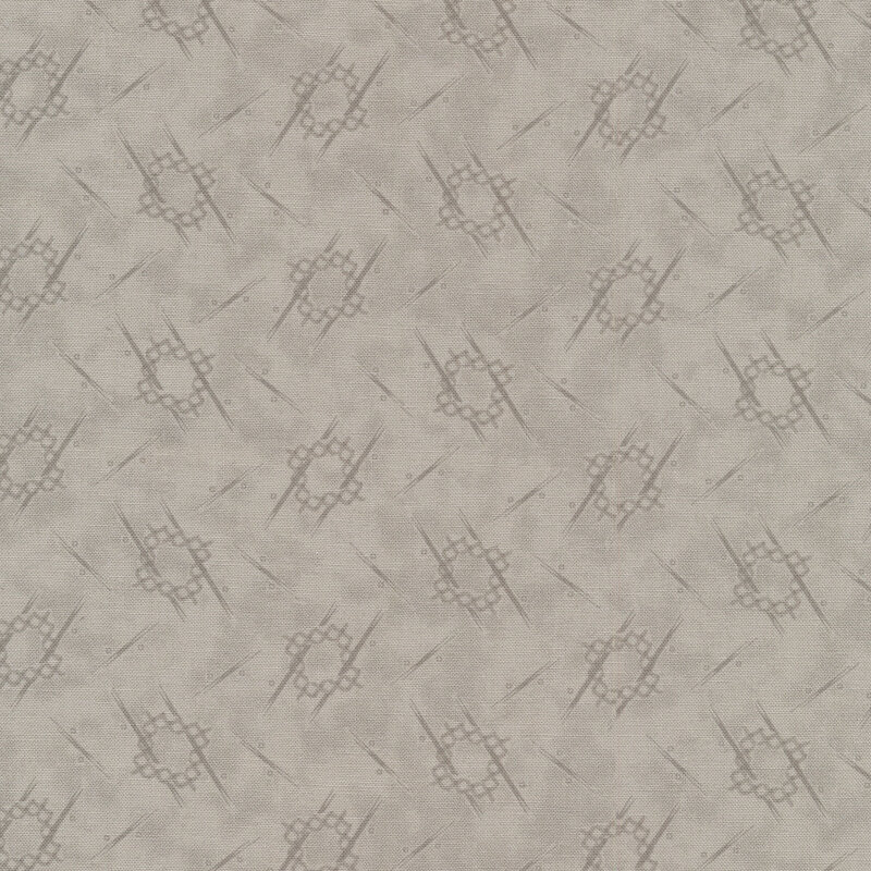 Mottled gray fabric with distressed zig zag patterns all over