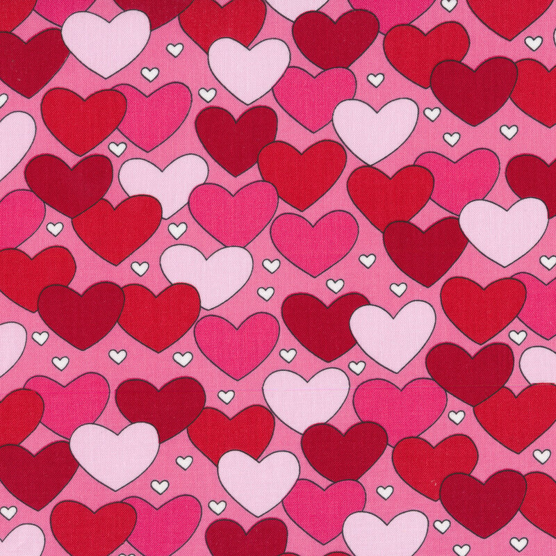 Pink fabric with red, pink, and light pink hearts all over