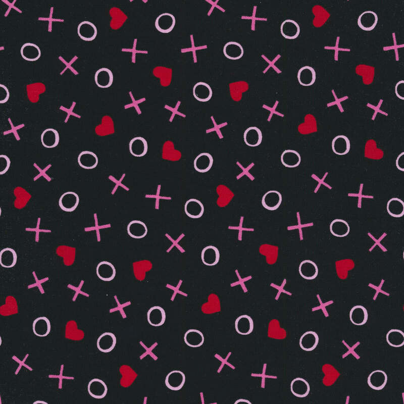 Sewing fabric with tossed x's and o's with and hearts all over a black background