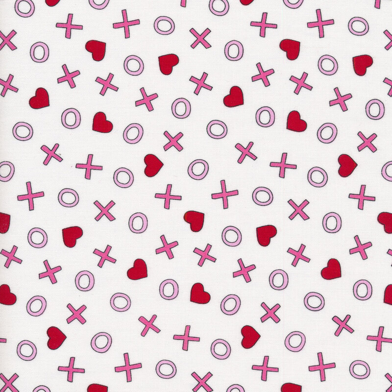 White sewing fabric with tossed x's and o's with and hearts all over a white background