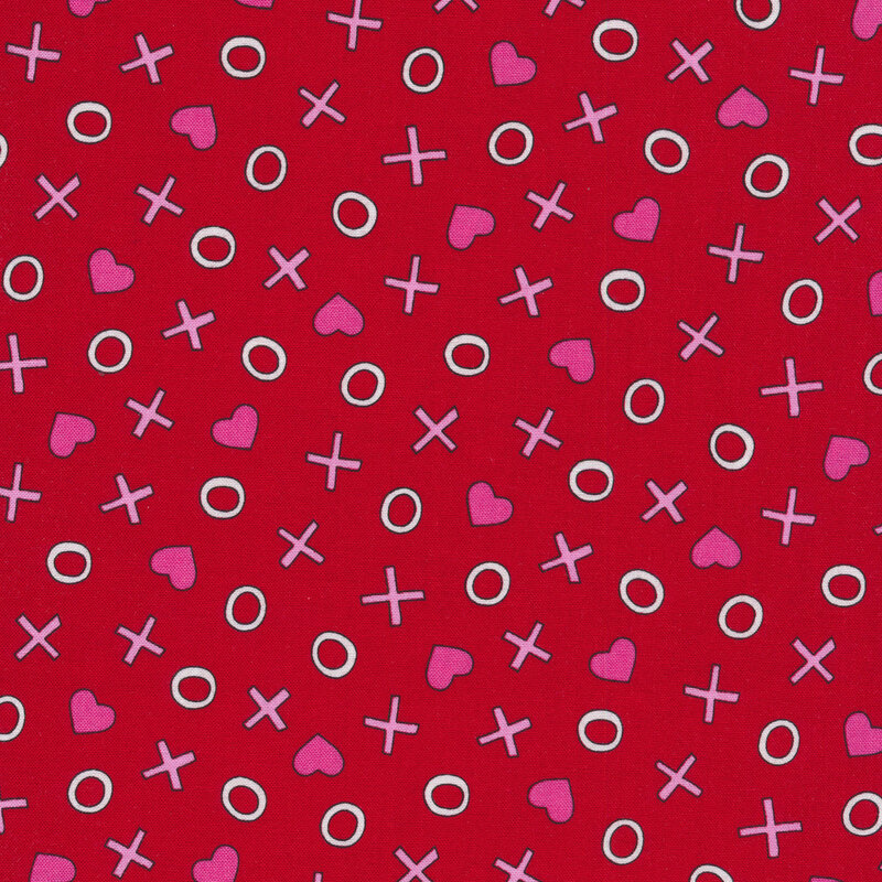 Red sewing fabric with tossed x's and o's with and hearts all over