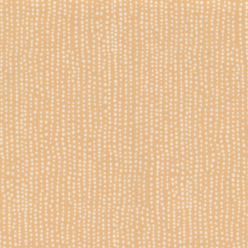 Beige fabric with small white dots all over