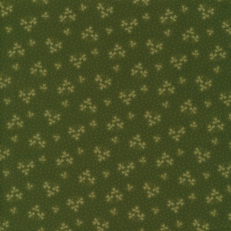 Solid green fabric with light green shamrock clusters all over