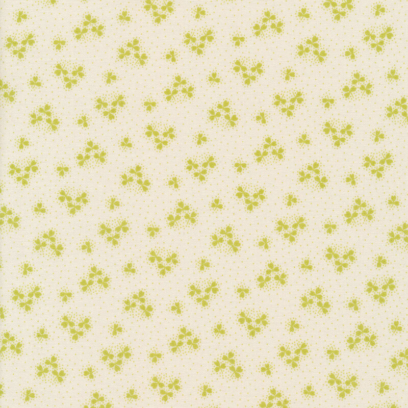 White fabric with green shamrock clusters and dots all over