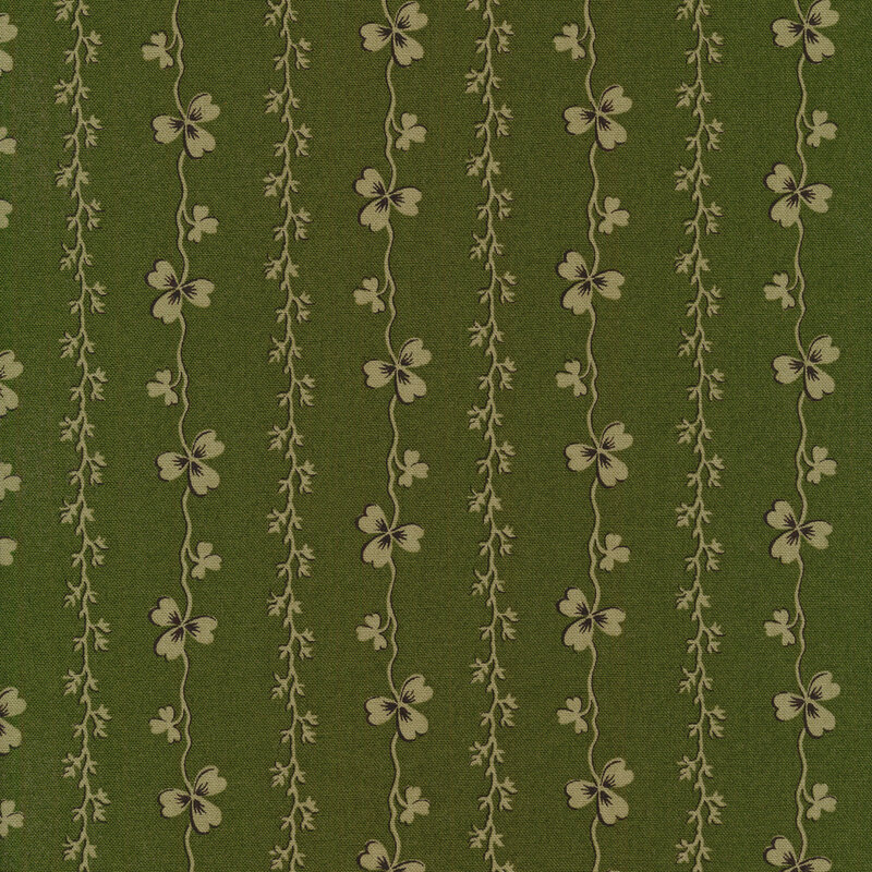 Tonal green fabric with light green stripes of shamrocks and vines