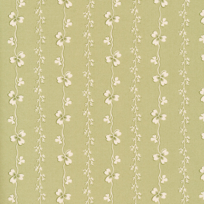 Light green fabric with white stripes of shamrocks and vines