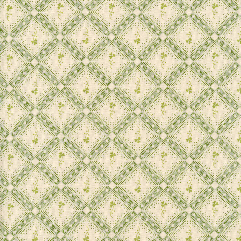 Cream and green plaid fabric with small green shamrock sprigs.