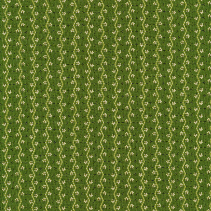 Green fabric with small white flowers and white zig zag stripes