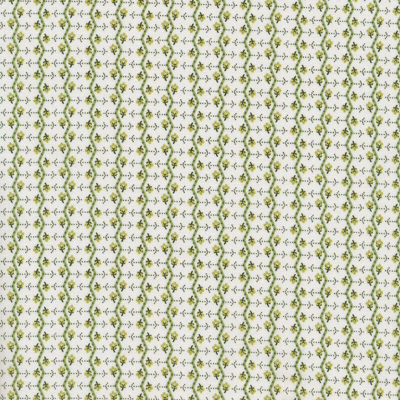 White fabric with small green flowers and green zig zag stripes