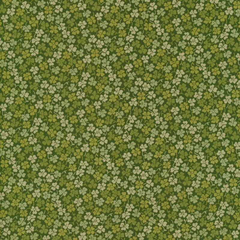 Tonal green fabric full of clovers and shamrocks