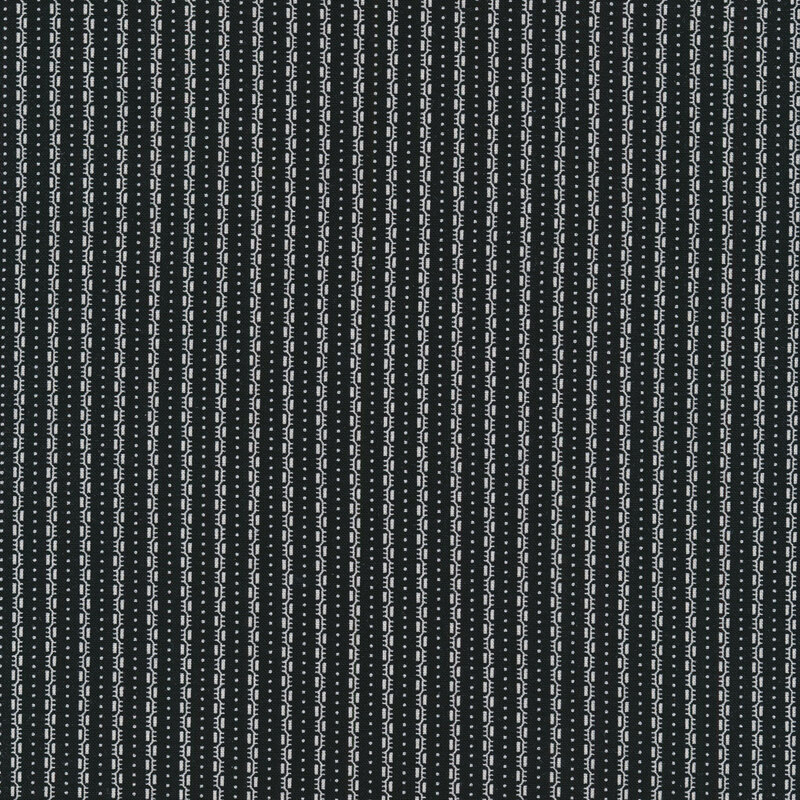 Black fabric with white dashed stripes and small white pin dots