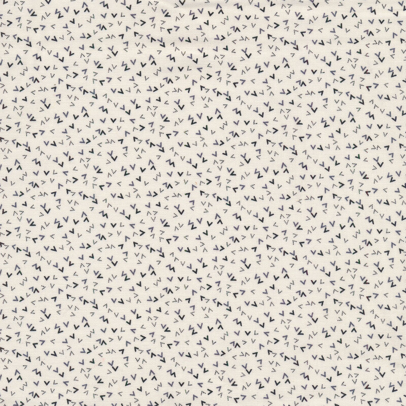 Cream fabric with tossed black and gray peaks all over