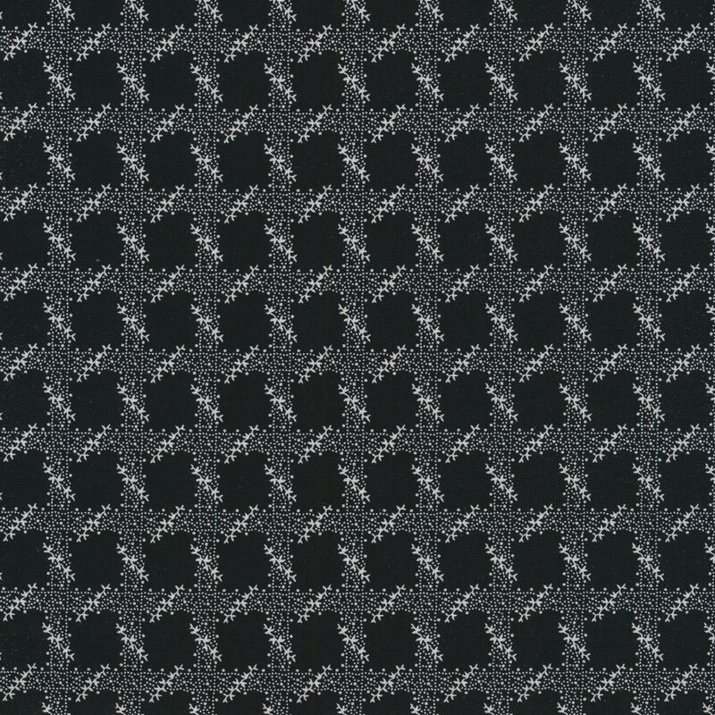 Black fabric with a white trellis design all over
