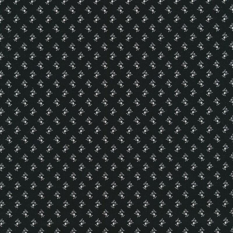 Black fabric with small white flower buds all over