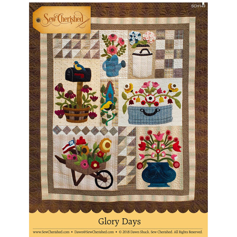 front of Glory Days quilt pattern booklet featuring a finished quilt with flowers in planters, a wheelbarrow, mailbox, and birds