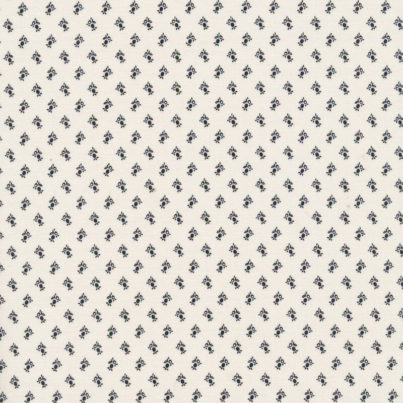 Cream fabric with small black flower buds all over