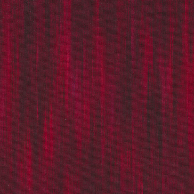 Wine red tonal fabric in a striped and mottled pattern