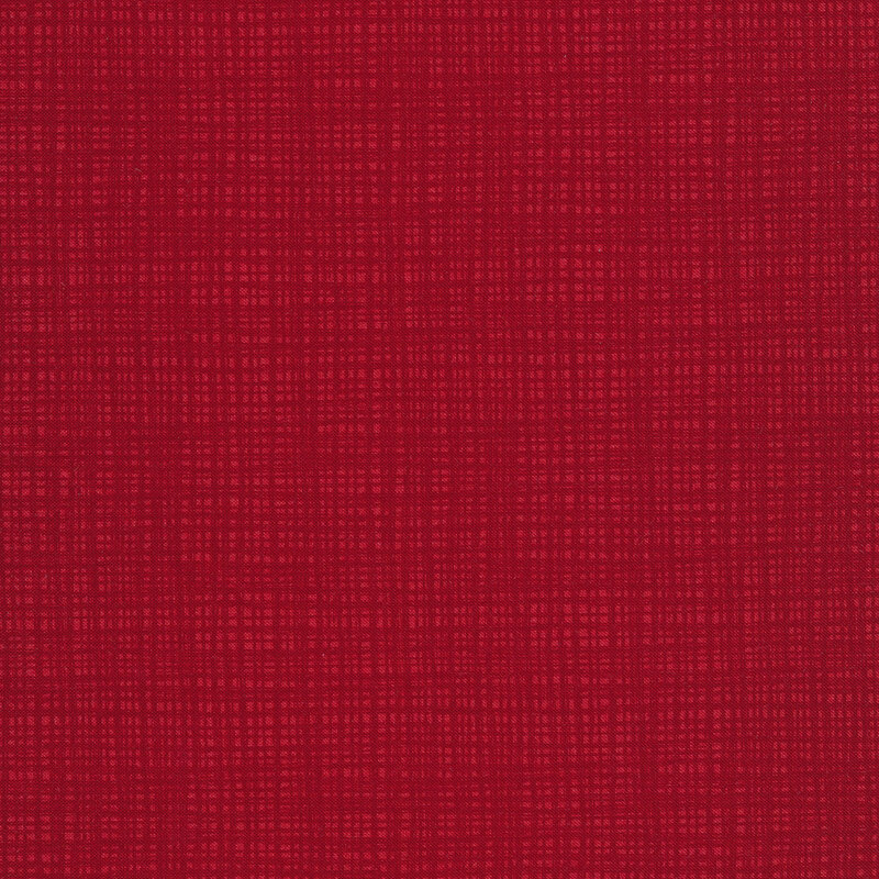 A tonal red fabric with a textured background