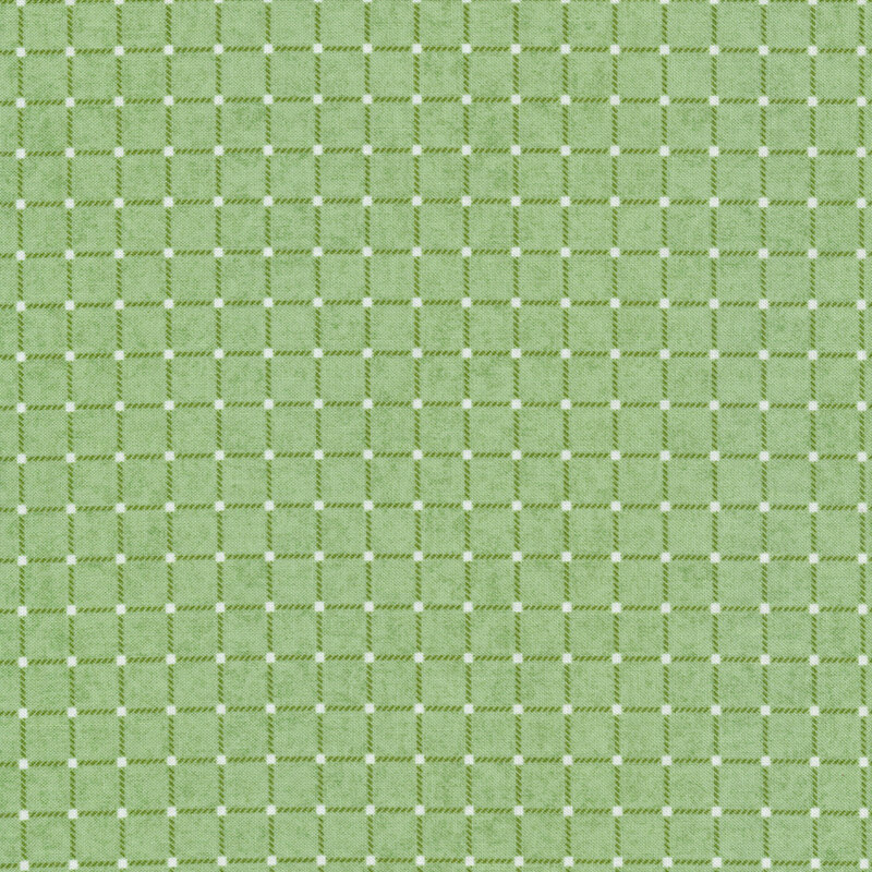 Light green fabric with dark green outlines making touching squares