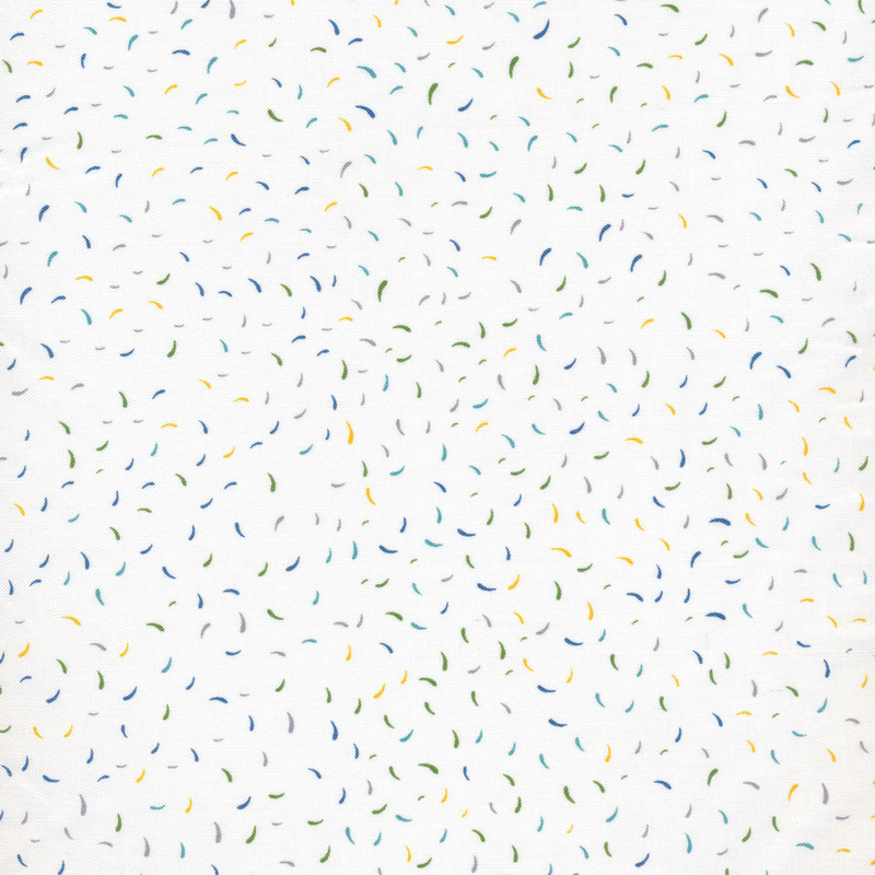 White fabric with tossed colorful confetti all over