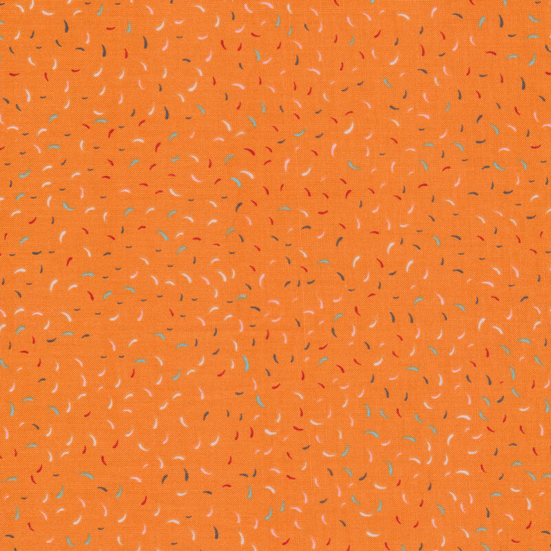 Bright orange fabric with tossed colorful confetti all over