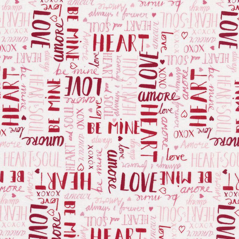 Fabric with red and pink love-themed words all over a white background