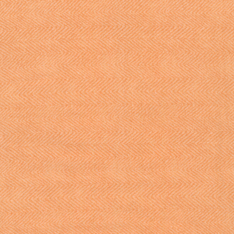 orange flannel herringbone fabric with a chevron pattern