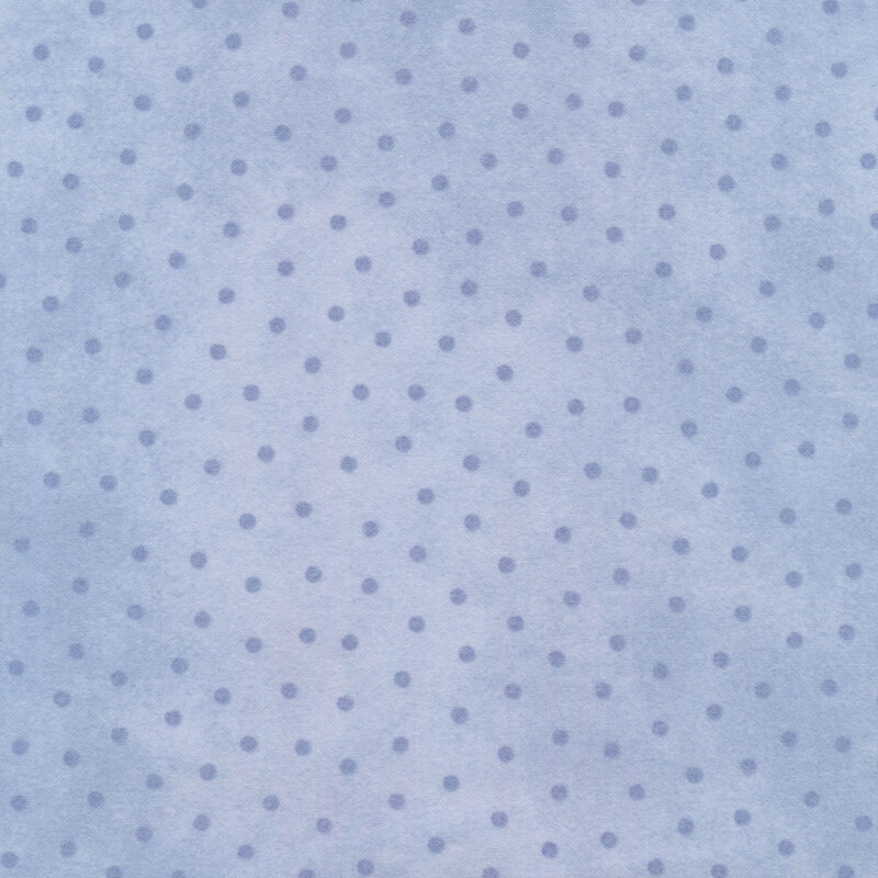 mottled light blue fabric with blue polka dots all over