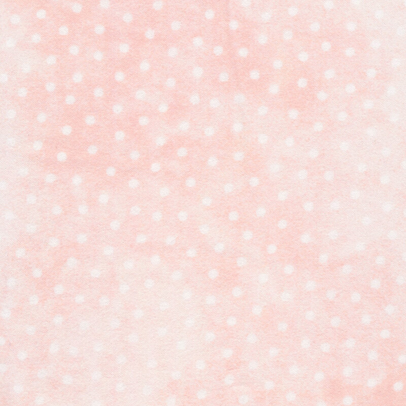 pastel pink flannel fabric with white polka dots all over
