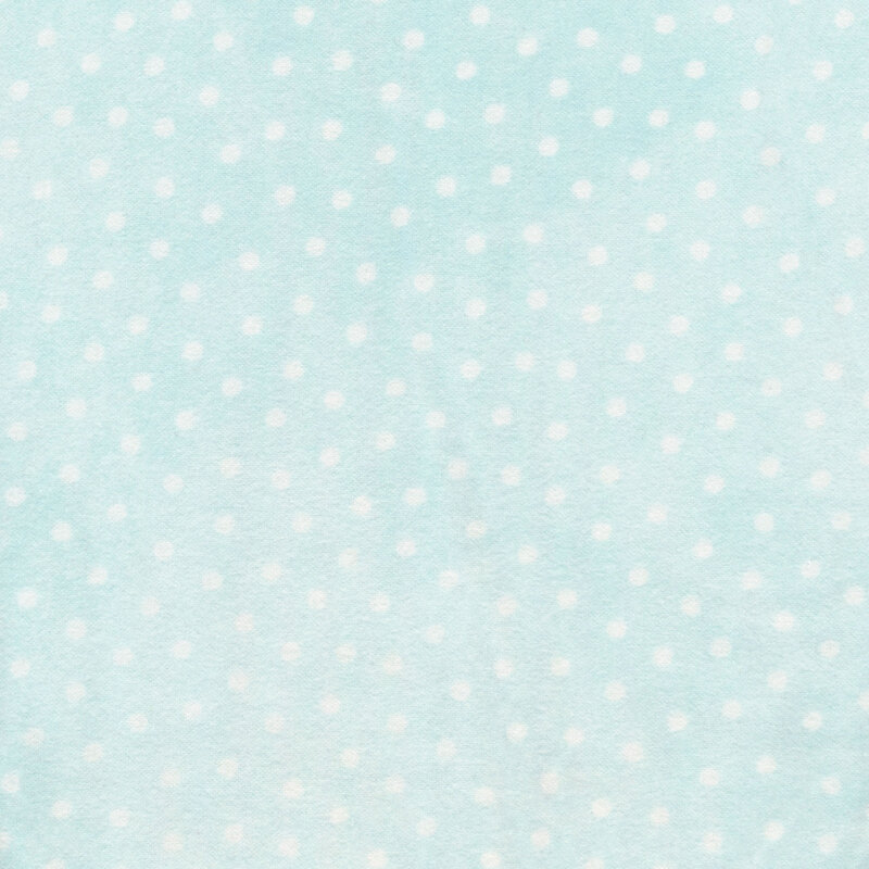 light aqua flannel fabric with white polka dots all over