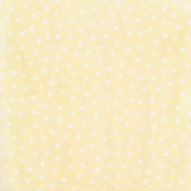 yellow flannel fabric with white polka dots all over