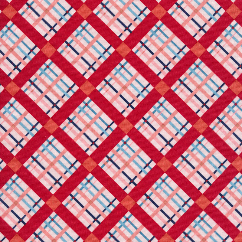 fabric with a pink, red, and blue plaid pattern
