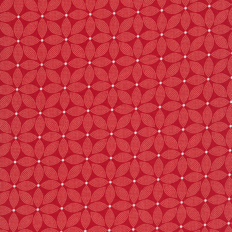 Red fabric covered with light red florals made of small dots with a white center dot