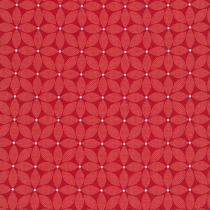 Red fabric covered with light red florals made of small dots with a white center dot