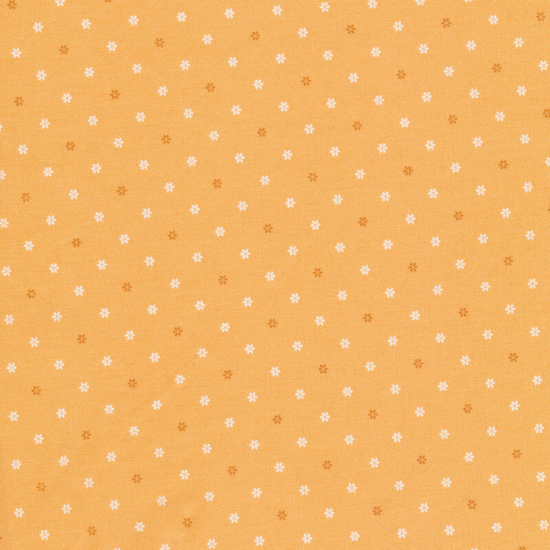 yellow fabric featuring white and yellow flower shaped polka dots all over