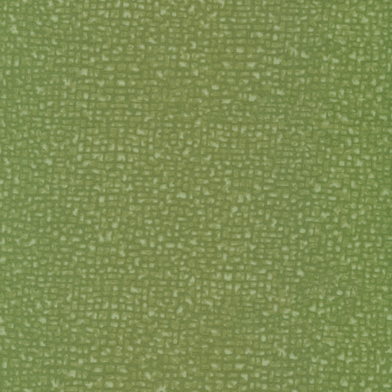 dense cracked lines on a green fabric background