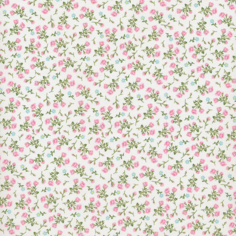 cream fabric with pink and green flowers scattered all over