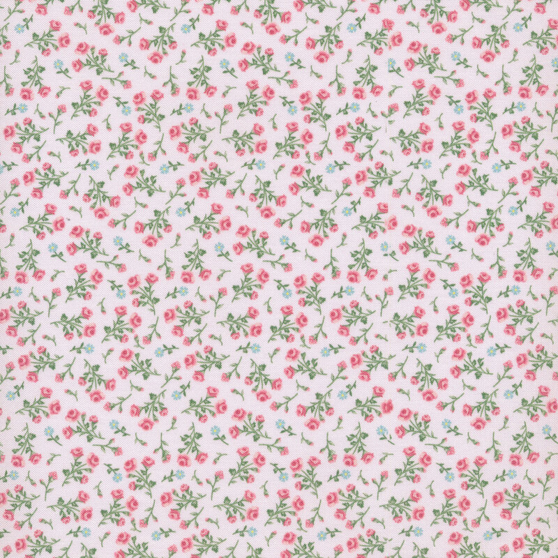 light pink fabric with pink and blue flowers scattered all over