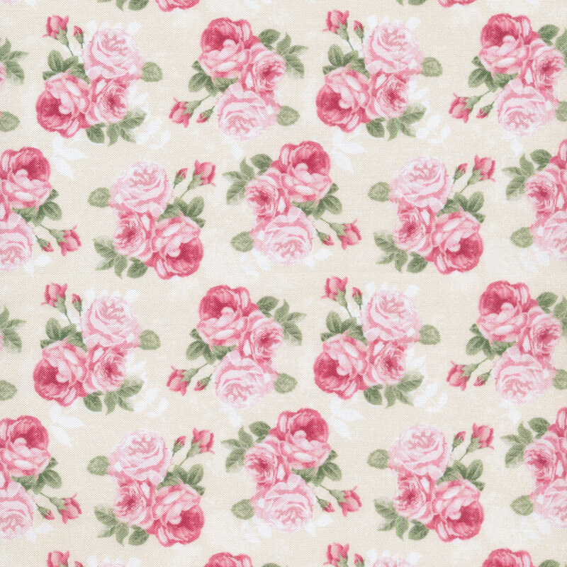 clusters of pink roses all over a cream fabric background