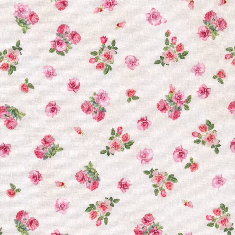 pink roses scattered all over a cream fabric background