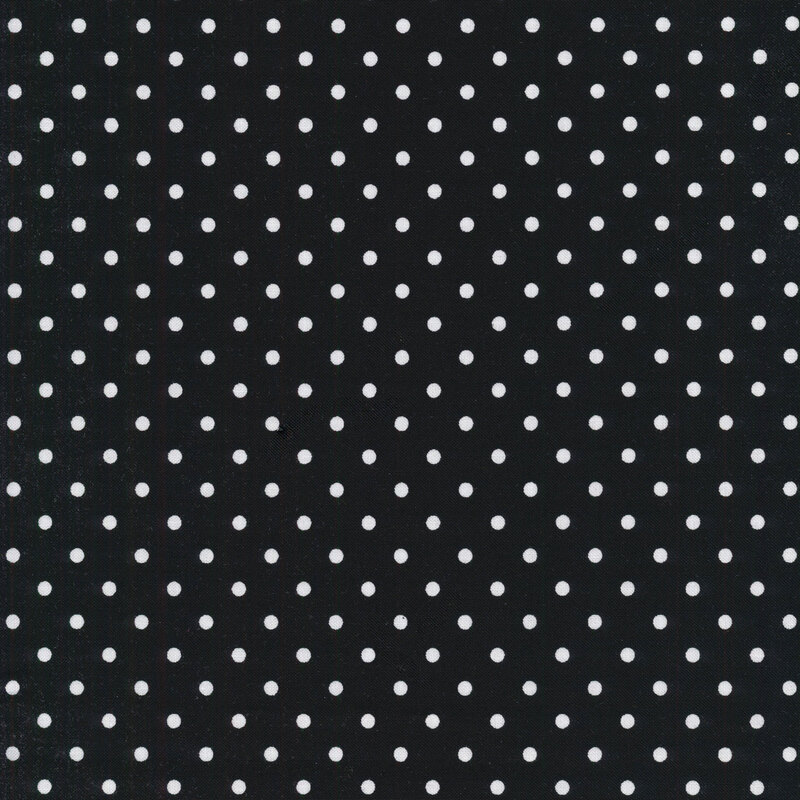 Black fabric with white polka dots