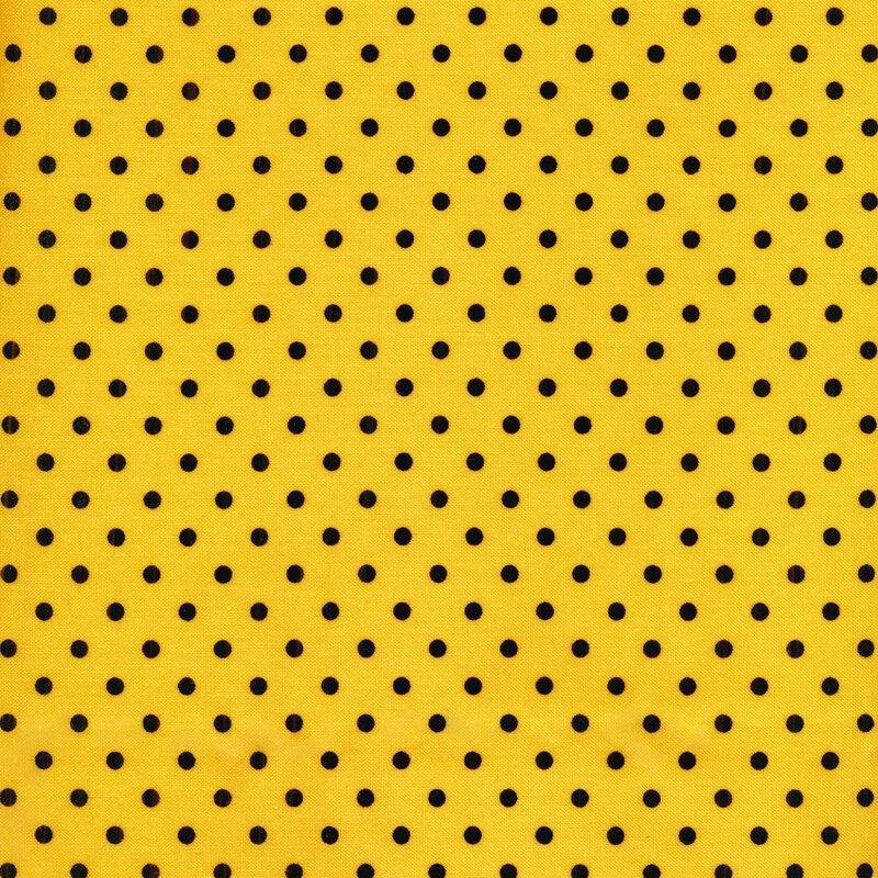 yellow fabric with black polka dots