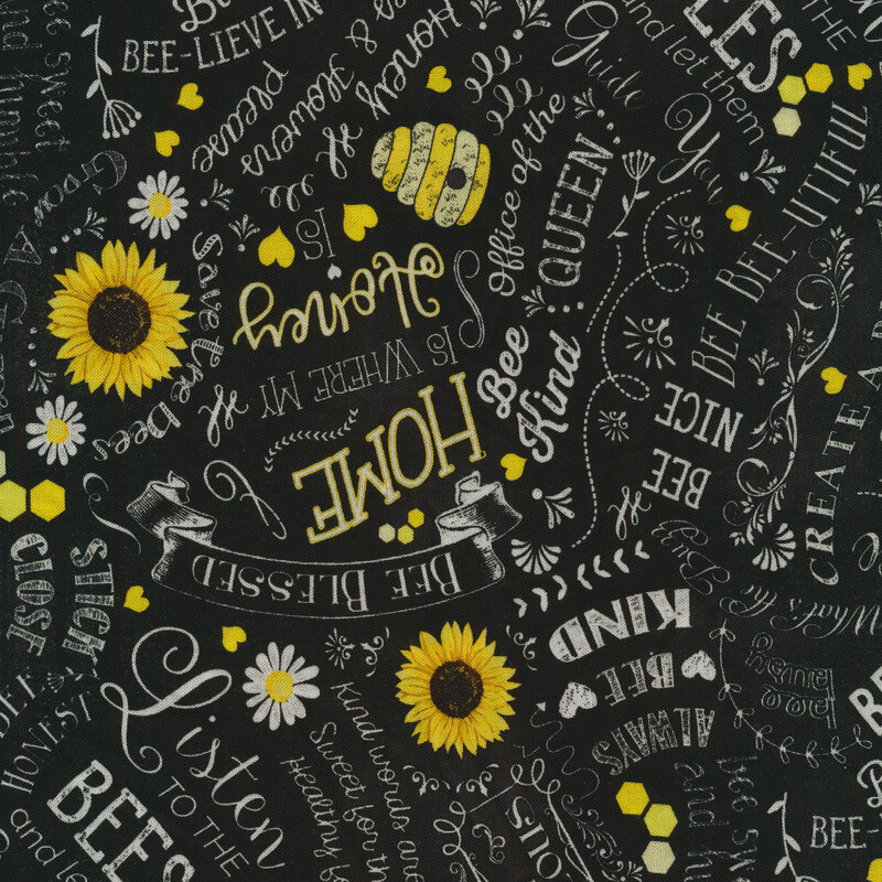 Black fabric with white words and yellow flowers packed together