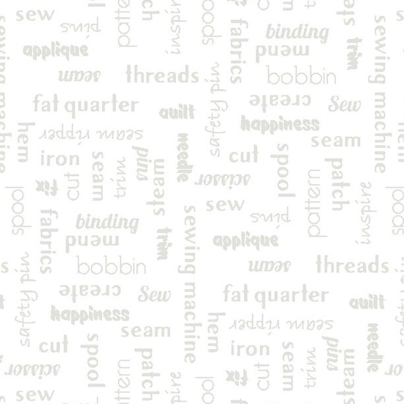 light grey words all over a white fabric background